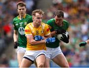 25 June 2023; Padraic Harnan of Meath in action against Dominic McEnhill of Antrim during the Tailteann Cup Semi Final match between Antrim and Meath at Croke Park in Dublin. Photo by Michael P Ryan/Sportsfile