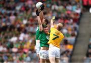 25 June 2023; Padraic Harnan of Meath claims the ball ahead of Marc Jordan of Antrim during the Tailteann Cup Semi Final match between Antrim and Meath at Croke Park in Dublin. Photo by Michael P Ryan/Sportsfile