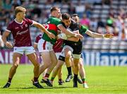 25 June 2023; Galway goalkeeper Connor Gleeson is tackled by Ryan O'Donoghue of Mayo during the GAA Football All-Ireland Senior Championship Preliminary Quarter Final match between Galway and Mayo at Pearse Stadium in Galway. Photo by Brendan Moran/Sportsfile