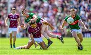 25 June 2023; Seán Fitzgerald of Galway in action against Stephen Coen of Mayo during the GAA Football All-Ireland Senior Championship Preliminary Quarter Final match between Galway and Mayo at Pearse Stadium in Galway. Photo by Seb Daly/Sportsfile