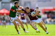 25 June 2023; Damien Comer of Galway in action against Jason Doherty of Mayo during the GAA Football All-Ireland Senior Championship Preliminary Quarter Final match between Galway and Mayo at Pearse Stadium in Galway. Photo by Seb Daly/Sportsfile
