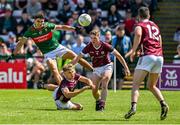 25 June 2023; Cian Hernon, left, and Jack Glynn of Galway block a shot by Tommy Conroy of Mayo during the GAA Football All-Ireland Senior Championship Preliminary Quarter Final match between Galway and Mayo at Pearse Stadium in Galway. Photo by Brendan Moran/Sportsfile