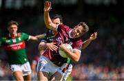 25 June 2023; Paul Conroy of Galway is tackled by Diarmuid O'Connor of Mayo during the GAA Football All-Ireland Senior Championship Preliminary Quarter Final match between Galway and Mayo at Pearse Stadium in Galway. Photo by Brendan Moran/Sportsfile