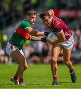 25 June 2023; John Maher of Galway is tackled by Jordan Flynn of Mayo during the GAA Football All-Ireland Senior Championship Preliminary Quarter Final match between Galway and Mayo at Pearse Stadium in Galway. Photo by Brendan Moran/Sportsfile