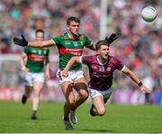 25 June 2023; Cathal Sweeney of Galway in action against Jordan Flynn of Mayo during the GAA Football All-Ireland Senior Championship Preliminary Quarter Final match between Galway and Mayo at Pearse Stadium in Galway. Photo by John Sheridan/Sportsfile