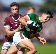 25 June 2023;Jason Doherty of Mayo in action against Paul Conroy of Galway during the GAA Football All-Ireland Senior Championship Preliminary Quarter Final match between Galway and Mayo at Pearse Stadium in Galway. Photo by John Sheridan/Sportsfile