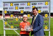 25 June 2023; Lauren McConville of Armagh receives the Player of the Match award from Uachtarán Cumann Peil Gael na mBan, Mícheál Naughton following the 2023 TG4 All-Ireland Ladies Senior Football Championship Group 1 Round 2 fixture between Armagh and Mayo at the Box-IT Athletic Grounds, Armagh. n Photo by Sam Barnes/Sportsfile