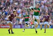 25 June 2023; Eoghan McLaughlin of Mayo in action against Cian Hernon of Galway during the GAA Football All-Ireland Senior Championship Preliminary Quarter Final match between Galway and Mayo at Pearse Stadium in Galway. Photo by Seb Daly/Sportsfile