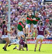 25 June 2023; Mayo players, from left, Jack Carney, David McBrien and Jordan Flynn contest for the ball during the GAA Football All-Ireland Senior Championship Preliminary Quarter Final match between Galway and Mayo at Pearse Stadium in Galway. Photo by Seb Daly/Sportsfile