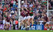 25 June 2023; Jordan Flynn of Mayo, centre right, attempts to clear a dropping ball, under pressure from John McGrath and Cillian McDaid of Galway the GAA Football All-Ireland Senior Championship Preliminary Quarter Final match between Galway and Mayo at Pearse Stadium in Galway. Photo by Brendan Moran/Sportsfile