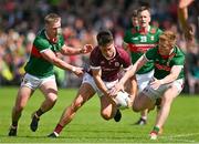 25 June 2023; Seán Kelly of Galway is tackled by Ryan O'Donoghue, left, and David McBrien of Mayo during the GAA Football All-Ireland Senior Championship Preliminary Quarter Final match between Galway and Mayo at Pearse Stadium in Galway. Photo by Brendan Moran/Sportsfile