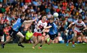 25 June 2023; Johnny McGuckin of Derry in action against Cillian Emmett, left, and Jack O'Sullivan of Dublin during the Electric Ireland GAA Football All-Ireland Minor Championship Semi Final match between Dublin and Derry at Box-It Athletic Grounds in Armagh. Photo by Sam Barnes/Sportsfile
