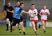 25 June 2023; Eamon Young of Derry in action against Alex Carolan of Dublin during the Electric Ireland GAA Football All-Ireland Minor Championship Semi Final match between Dublin and Derry at Box-It Athletic Grounds in Armagh. Photo by Sam Barnes/Sportsfile