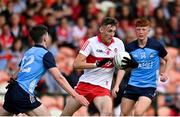 25 June 2023; Tommy Rogers of Derry in action against Noah Byrne of Dublin during the Electric Ireland GAA Football All-Ireland Minor Championship Semi Final match between Dublin and Derry at Box-It Athletic Grounds in Armagh. Photo by Sam Barnes/Sportsfile