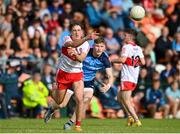 25 June 2023; James Sargent of Derry in action against Shane Mullarkey of Dublin during the Electric Ireland GAA Football All-Ireland Minor Championship Semi Final match between Dublin and Derry at Box-It Athletic Grounds in Armagh. Photo by Sam Barnes/Sportsfile