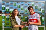 25 June 2023; James Sargent of Derry receives the Electric Ireland Player of the Match award from Electric Ireland Brand and Sponsorship Manager Aiste Petraityte following his performance in the Electric Ireland GAA All-Ireland Minor Football Championship Semi Final match between Dublin and Derry at Box-It Athletic Grounds in Armagh. Photo by Sam Barnes/Sportsfile