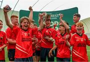 25 June 2023; Emo players celebrate after their side's victory in the rounders final at the John West Féile Peil na nÓg at Connacht GAA Centre of Excellence in Bekan, Mayo. Photo by Stephen Marken/Sportsfile