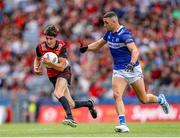 25 June 2023; Eugene Branagan of Down in action against Robert Pigott of Laois during the Tailteann Cup Semi Final match between Down and Laois at Croke Park in Dublin. Photo by Michael P Ryan/Sportsfile
