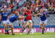 25 June 2023; Ruairi O Hare of Down in action against Laois players Sean Greene, left, and Alex Mohan during the Tailteann Cup Semi Final match between Down and Laois at Croke Park in Dublin. Photo by Michael P Ryan/Sportsfile