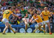 25 June 2023; James McEntee of Meath in action against Antrim players from left, Gerard Walsh, Patrick McCormick, and Ronan Boyle during the Tailteann Cup Semi Final match between Antrim and Meath at Croke Park in Dublin. Photo by Michael P Ryan/Sportsfile