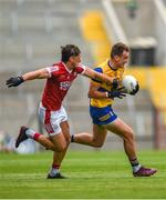 24 June 2023; Enda Smith of Roscommon is tackled by Colm O’Callaghan of Cork during the GAA Football All-Ireland Senior Championship Preliminary Quarter Final match between Cork and Roscommon at Páirc Uí Chaoimh in Cork. Photo by Tom Beary/Sportsfile