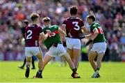 25 June 2023; Ryan O'Donoghue of Mayo, second from left, kicks out at the ankle of Galway's Seán Kelly, 3, before the start of the second half during the GAA Football All-Ireland Senior Championship Preliminary Quarter Final match between Galway and Mayo at Pearse Stadium in Galway. Photo by Seb Daly/Sportsfile