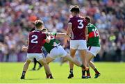 25 June 2023; Ryan O'Donoghue of Mayo, second from left, kicks out at the ankle of Galway's Seán Kelly, 3, during the GAA Football All-Ireland Senior Championship Preliminary Quarter Final match between Galway and Mayo at Pearse Stadium in Galway. Photo by Seb Daly/Sportsfile