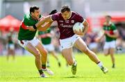 25 June 2023; Damien Comer of Galway in action against Jason Doherty of Mayo  during the GAA Football All-Ireland Senior Championship Preliminary Quarter Final match between Galway and Mayo at Pearse Stadium in Galway. Photo by Seb Daly/Sportsfile