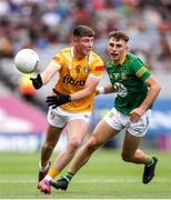 25 June 2023; Adam Loughran of Antrim in action against Seán Coffey of Meath during the Tailteann Cup Semi Final match between Antrim and Meath at Croke Park in Dublin. Photo by Michael P Ryan/Sportsfile
