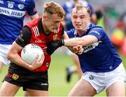 25 June 2023; Liam Kerr of Down in action against Alex Mohan of Laois during the Tailteann Cup Semi Final match between Down and Laois at Croke Park in Dublin. Photo by Michael P Ryan/Sportsfile