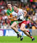 24 June 2023; Brian Kennedy of Tyrone in action against Jason McGee of Donegal during the GAA Football All-Ireland Senior Championship Preliminary Quarter Final match between Donegal and Tyrone at MacCumhaill Park in Ballybofey, Donegal. Photo by Brendan Moran/Sportsfile