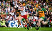 24 June 2023; Conn Kilpatrick of Tyrone of Tyrone breaks away from Jamie Brennan of Donegal during the GAA Football All-Ireland Senior Championship Preliminary Quarter Final match between Donegal and Tyrone at MacCumhaill Park in Ballybofey, Donegal. Photo by Brendan Moran/Sportsfile