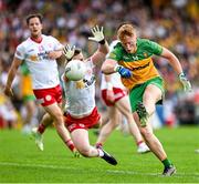 24 June 2023; Oisin Gallen of Donegal in action against Michael O’Neill of Tyrone during the GAA Football All-Ireland Senior Championship Preliminary Quarter Final match between Donegal and Tyrone at MacCumhaill Park in Ballybofey, Donegal. Photo by Brendan Moran/Sportsfile