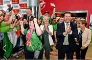 26 June 2023; Team Ireland's Katie Dillion, a member of Mountbellew Tigers Special Olympics Club, from Balllinasloe, Galway, and Matt English, CEO of Special Olympics Ireland, lead out the team on their return to Dublin Aiport from the World Special Olympic Games in Berlin, Germany. Photo by Sam Barnes/Sportsfile