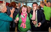 26 June 2023; Team Ireland's Katie Dillion, a member of Mountbellew Tigers Special Olympics Club, from Balllinasloe, Galway, and Matt English, CEO of Special Olympics Ireland, lead out the team on their return to Dublin Aiport from the World Special Olympic Games in Berlin, Germany. Photo by Sam Barnes/Sportsfile