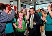 26 June 2023; Team Ireland's Katie Dillion, a member of Mountbellew Tigers Special Olympics Club, from Balllinasloe, Galway, and Matt English, CEO of Special Olympics Ireland, lead out the team on their return to Dublin Aiport from the World Special Olympic Games in Berlin, Germany. Photo by Sam Barnes/Sportsfile