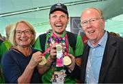 26 June 2023; Team Ireland's Timothy Morahan, a member of South Dublin Sports Club, from Dublin 6, pictured with parents, Emmy and John Morahan at Dublin Airport on the team's return from the World Special Olympic Games in Berlin, Germany. Photo by Sam Barnes/Sportsfile