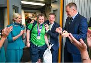 26 June 2023; Team Ireland's Emma Costello, a member of Navan Special Olympics Club, from Clonee, Dublin, is greeted by Matt English, CEO of Special Olympics Ireland and Minister of State at Department of Tourism, Culture, Arts, Gaeltacht, Sport and Media Thomas Byrne TD and Kelly Grant, Senior Cabin Crew Aer Lingus, at Dublin Airport on the team's return from the World Special Olympic Games in Berlin, Germany. Photo by Ray McManus/Sportsfile