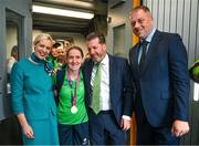 26 June 2023; Team Ireland's Jenna Carty, a member of Wexford Special Olympics Club, from Wexford Town, is greeted by Matt English, CEO of Special Olympics Ireland and Minister of State at Department of Tourism, Culture, Arts, Gaeltacht, Sport and Media Thomas Byrne TD and Kelly Grant, Senior Cabin Crew Aer Lingus, at Dublin Airport on the team's return from the World Special Olympic Games in Berlin, Germany. Photo by Ray McManus/Sportsfile