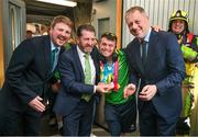 26 June 2023; Team Ireland's Aaron Lenzi, a member of LX Gymnastics Club, from Ballynahinch, Down, is greeted by Daniel Hurley, left, Senior Cabin Crew Aer Lingus, Matt English, CEO of Special Olympics Ireland and Minister of State at Department of Tourism, Culture, Arts, Gaeltacht, Sport and Media Thomas Byrne TD at Dublin Airport on the team's return from the World Special Olympic Games in Berlin, Germany. Photo by Ray McManus/Sportsfile