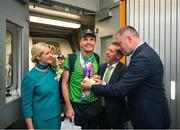 26 June 2023; Team Ireland's Timothy Morahan, a member of South Dublin Sports Club, from Dublin 6, is greeted by Minister of State at Department of Tourism, Culture, Arts, Gaeltacht, Sport and Media Thomas Byrne TD and Kelly Grant, Senior Cabin Crew, Aer Lingus, and Matt English, CEO of Special Olympics Ireland at Dublin Airport on the team's return from the World Special Olympic Games in Berlin, Germany. Photo by Ray McManus/Sportsfile