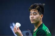 26 June 2023; Nhat Nguyen of Ireland inspects the shuttlecock during his match against Milan Dratva of Slovakia in the badminton Men's Singles Group at the Jaskolka Arena during the European Games 2023 in Poland. Photo by Tyler Miller/Sportsfile