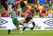26 June 2023; Jamie McGonigle of Derry City in action against Roberto Lopes of Shamrock Rovers during the SSE Airtricity Men's Premier Division match between Shamrock Rovers and Derry City at Tallaght Stadium in Dublin. Photo by Stephen McCarthy/Sportsfile
