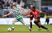 26 June 2023; Jack Byrne of Shamrock Rovers in action against Sadou Diallo of Derry City during the SSE Airtricity Men's Premier Division match between Shamrock Rovers and Derry City at Tallaght Stadium in Dublin. Photo by Stephen McCarthy/Sportsfile