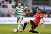 26 June 2023; Jack Byrne of Shamrock Rovers in action against Ronan Boyce of Derry City during the SSE Airtricity Men's Premier Division match between Shamrock Rovers and Derry City at Tallaght Stadium in Dublin. Photo by Stephen McCarthy/Sportsfile