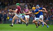 24 June 2023; Cianan Fahy of Galway is tackled by Ronan Maher  and Conor Bowe of Tipperary, right, during the GAA Hurling All-Ireland Senior Championship Quarter Final match between Galway and Tipperary at TUS Gaelic Grounds in Limerick. Photo by Ray McManus/Sportsfile