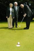 25 June 2004; Ita Butler, President of the Irish Ladies Golfing Union of Ireland, and Dick Cusack, centre, Golfing Union of Ireland, watch as Jim Kelly, AIB, putts at the launch of the AIB Golf Club of the Year Awards 2004. Elm Park Golf Club, Dublin. Picture credit; David Maher / SPORTSFILE