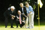 25 June 2004; Dick Cusack, far left, Golfing Union of Ireland, Jim Kelly, AIB, and Ita Butler, President of the Irish Ladies Golfing Union of Ireland, line up a putt for Hugh Gleeson, aged 12 from Dublin, at the launch of the AIB Golf Club of the Year Awards 2004. Elm Park Golf Club, Dublin. Picture credit; David Maher / SPORTSFILE