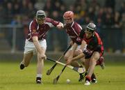 26 June 2004; Mark Kerins, left, and Alan Kerins, Galway, in action against Andy Bell, Down. Guinness Senior Hurling Championship Qualifier, Round 1, Down v Galway, McKenna Park, Ballycran, Co. Down. Picture credit; Brendan Moran / SPORTSFILE