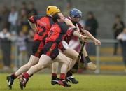 26 June 2004; Damien Hayes, Galway, is tackled by Liam Clarke (2) and Michael Braniff (22), Down. Guinness Senior Hurling Championship Qualifier, Round 1, Down v Galway, McKenna Park, Ballycran, Co. Down. Picture credit; Brendan Moran / SPORTSFILE